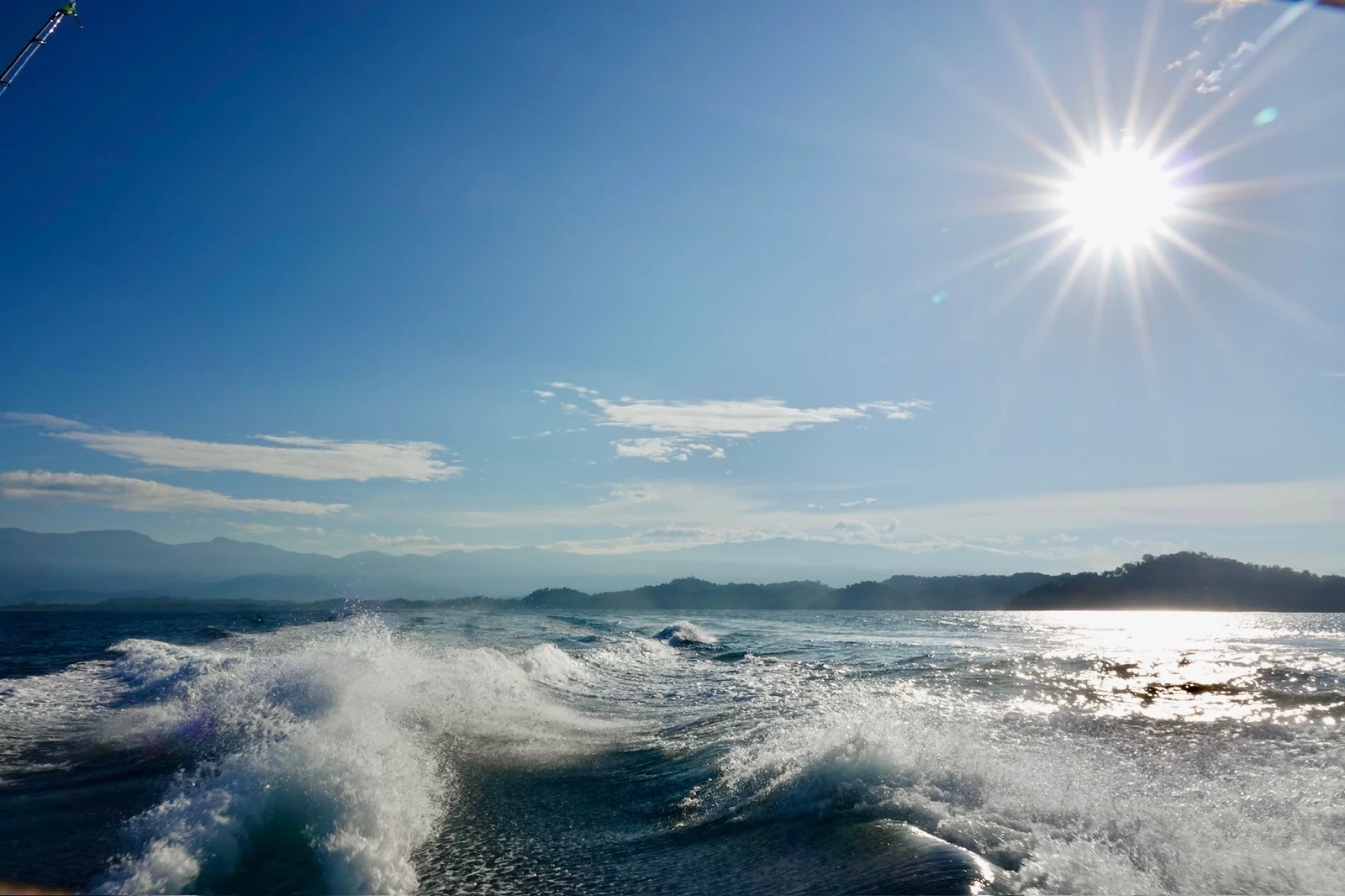 The Vuelto Loco's wake at sunrise off the Quepos coastline
